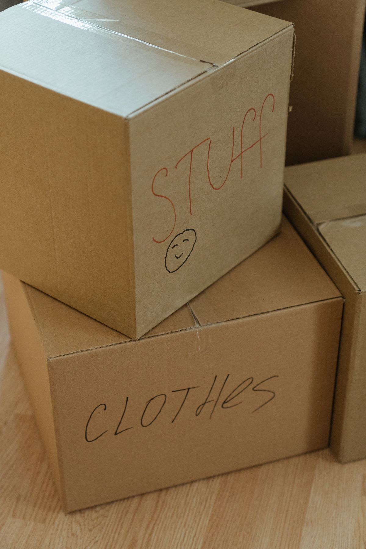Labelled moving boxes stacked in an empty room